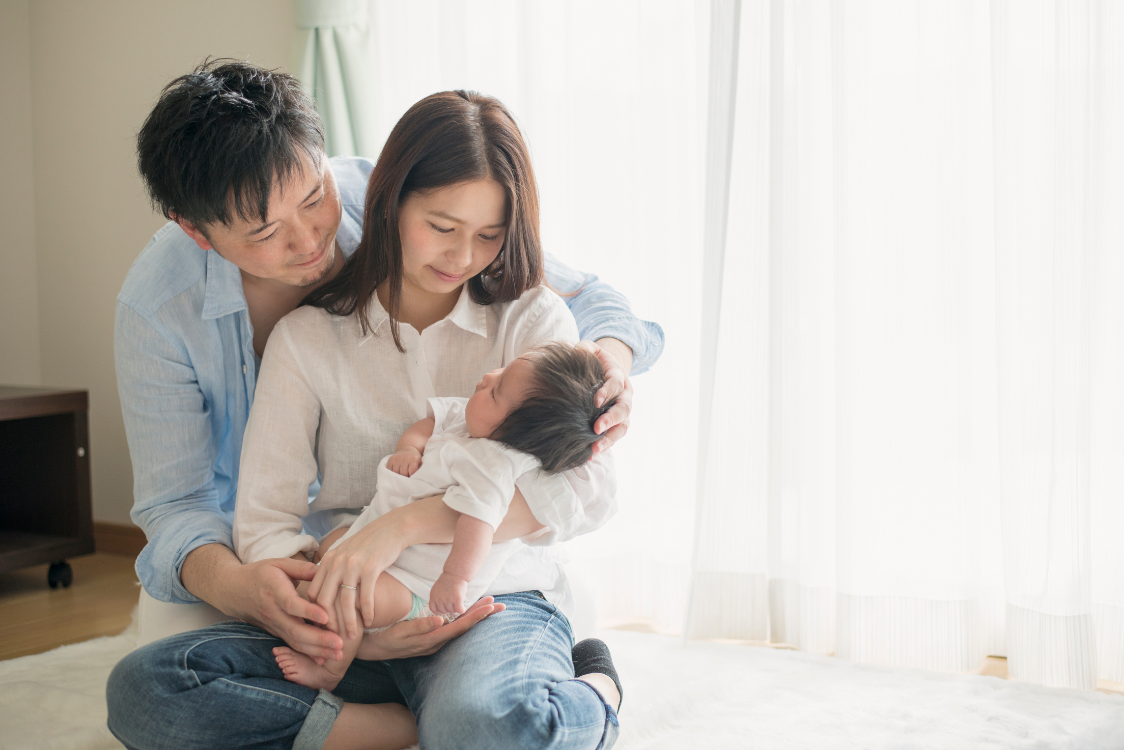 Happy family with newborn baby